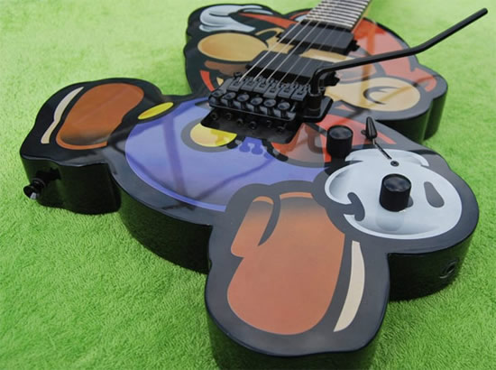 Playing the Super Mario theme on this Super Mario guitar is plain overkill super mario guitar 2